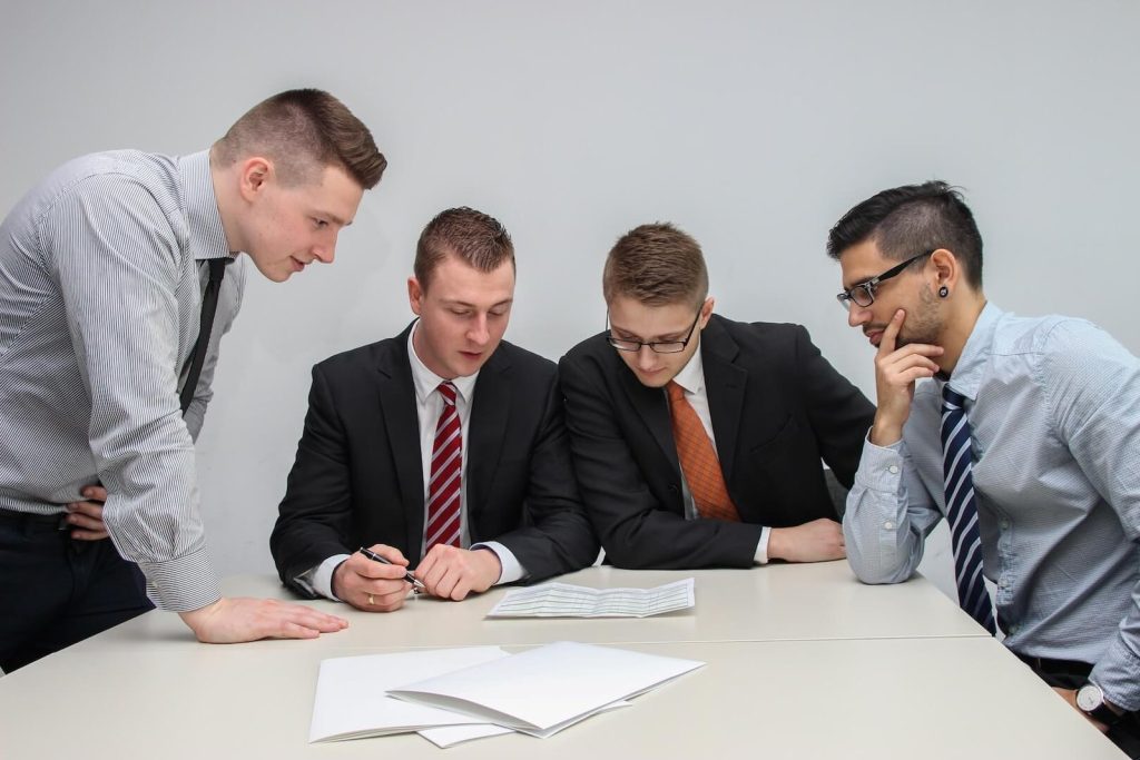 Business professionals reviewing financial documents during a focused strategy discussion
